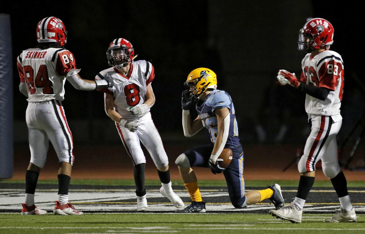 Elsinore's Caleb Brady (8) reacts to tripping up Marina's Dominic Harvey (26) for a safety in a nonleague football game.