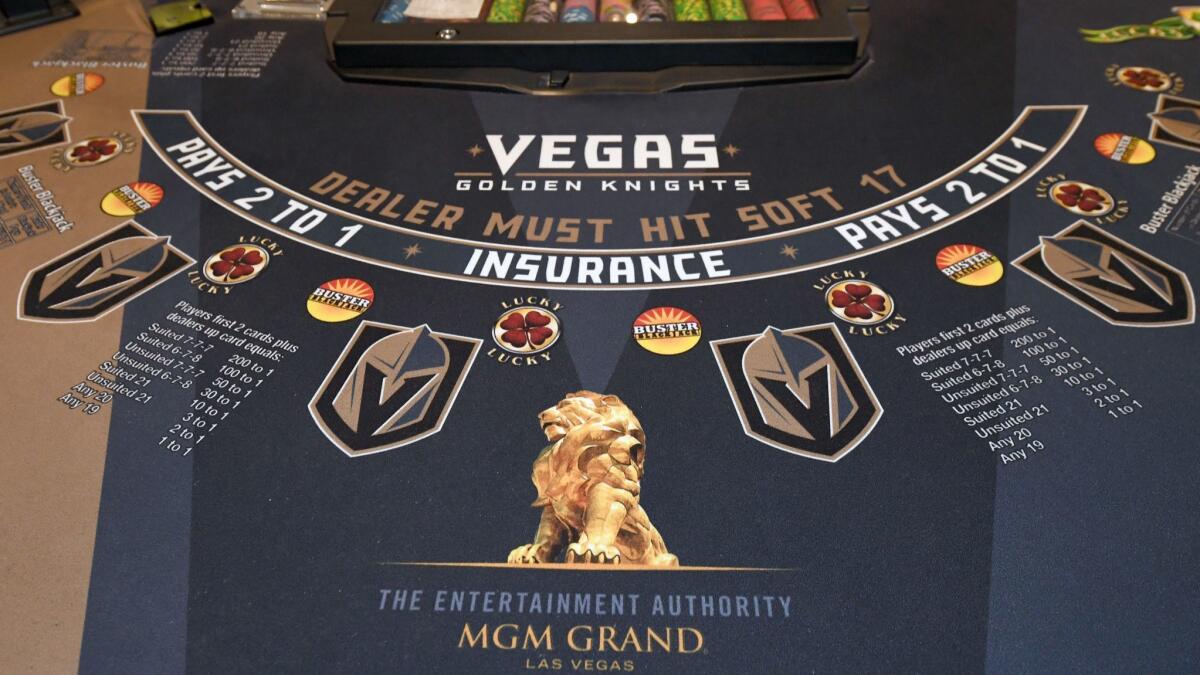A Vegas Golden Knights-themed felt covering on a blackjack table at MGM Grand Hotel & Casino.