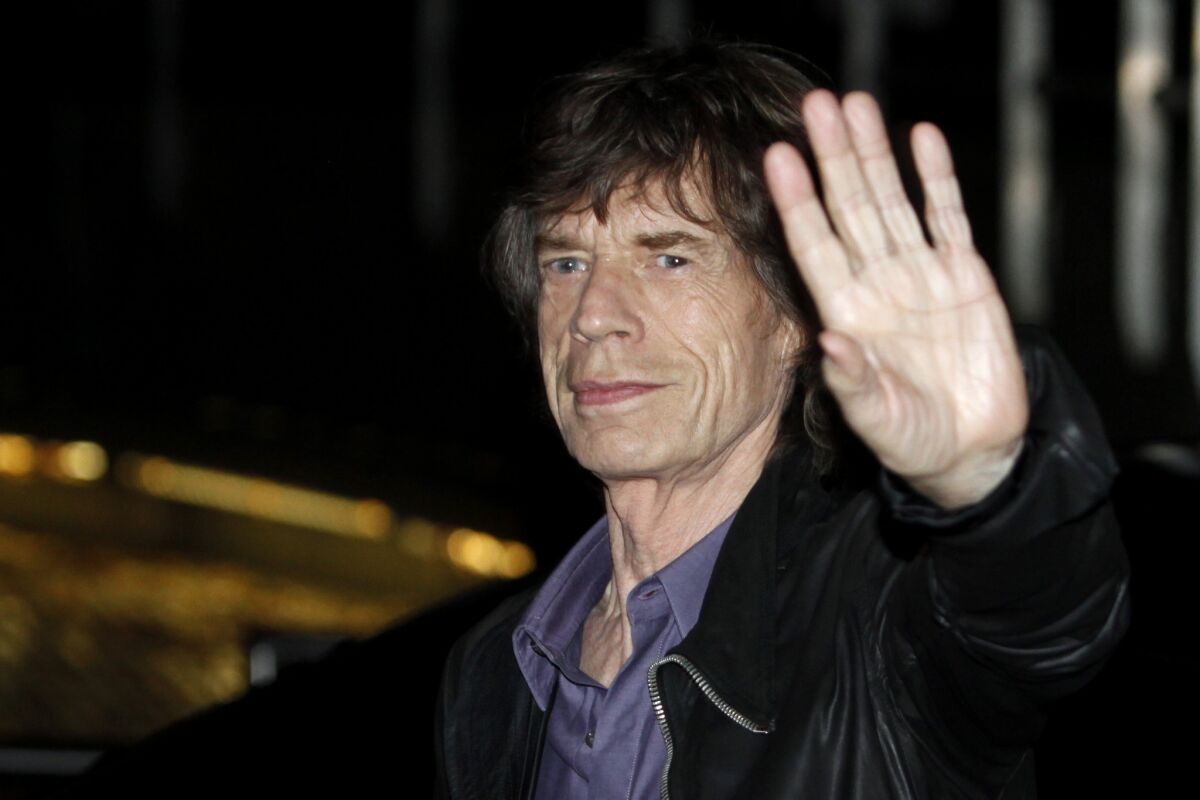 Mick Jagger arrives outside La Trabendo rock club in Paris for Rolling Stones' surprise show.