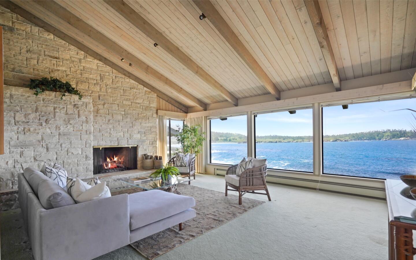 Built in 1981, the three-story home overlooks the ocean and features a path that winds toward the beach.