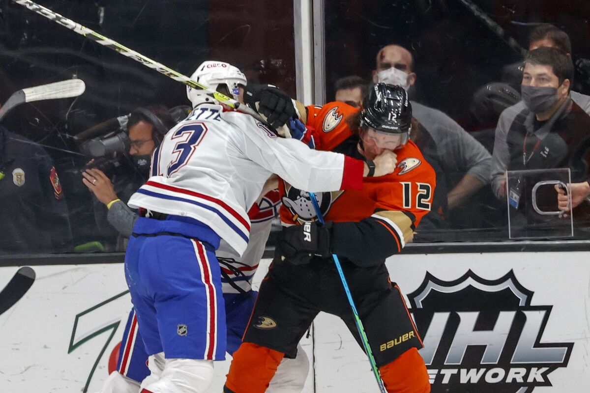 Montreal Canadiens forward Cedric Paquette, left, and Anaheim Ducks forward Sonny Milano fight during the first period of an NHL hockey game Sunday, Oct. 31, 2021, in Anaheim, Calif. (AP Photo/Ringo H.W. Chiu)