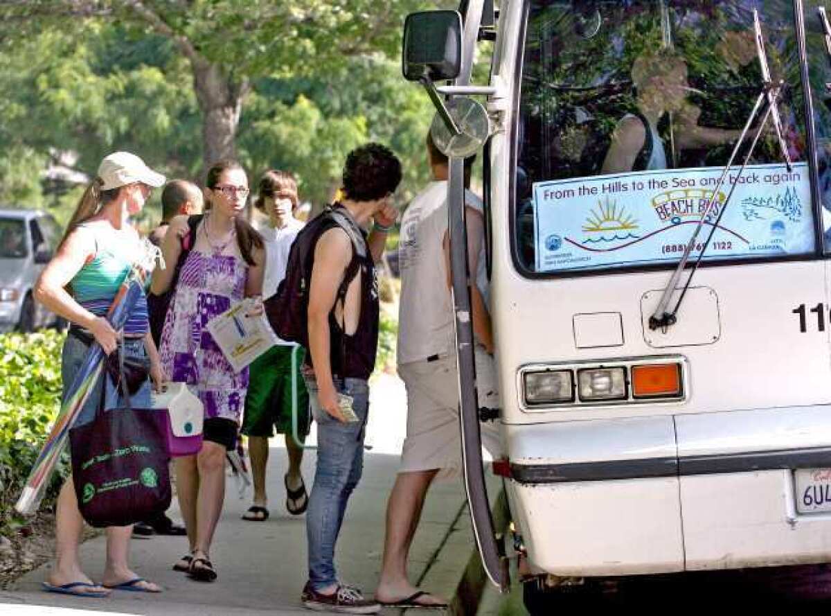 Local residents board the La Crescenta/La Canada Flintridge Beach Bus to start the Summer's first run at Two-Strike Park in La Crescenta in 2010. The service will return this summer.