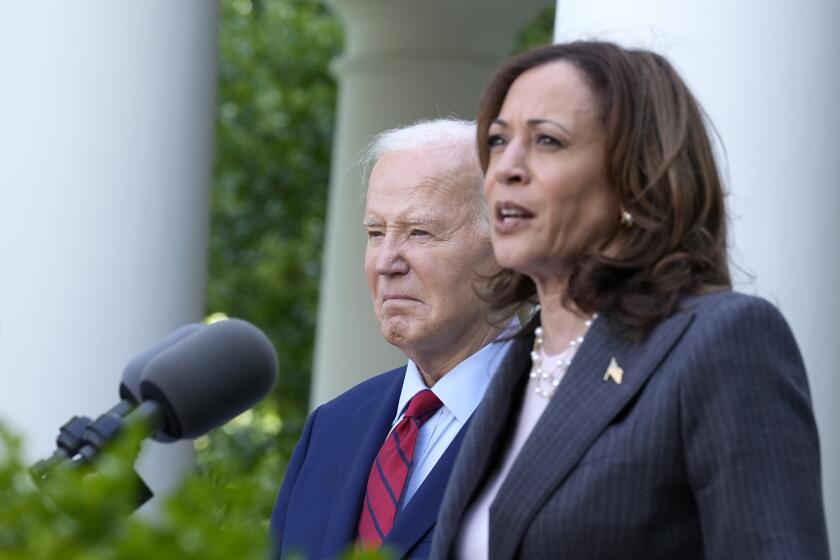 Vice President Kamala Harris speaks as President Joe Biden listens in the Rose Garden of the White House in Washington, Monday, May 13, 2024, during a reception celebrating Asian American, Native Hawaiian, and Pacific Islander Heritage Month. (AP Photo/Susan Walsh)