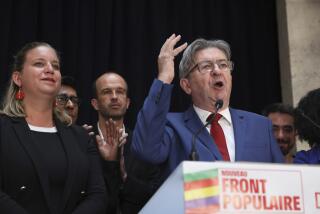 Far-left La France Insoumise - LFI - (France Unbowed) founder Jean-Luc Melenchon delivers a speech at the party election night headquarters, Sunday, July 7, 2024 in Paris. A coalition on the left that came together unexpectedly ahead of France's snap elections won the most parliamentary seats in the vote, according to polling projections Sunday. The surprise projections put President Emmanuel Macron's centrist alliance in second and the far right in third. At left is LFI's Mathilde Pant and at center Manuel Bompard. (AP Photo/Thomas Padilla)