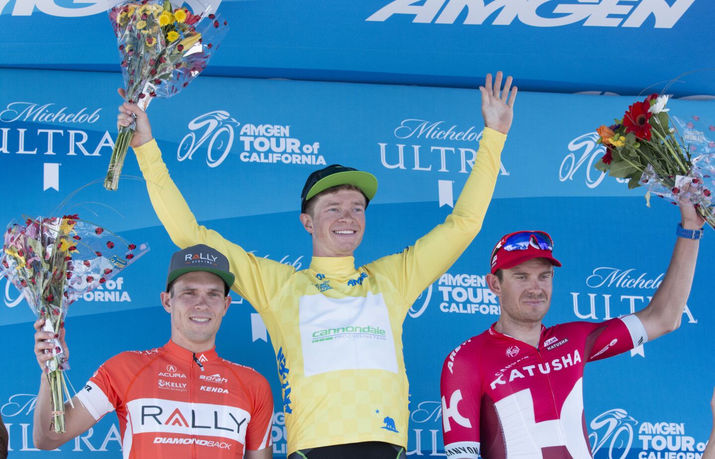 Ben King, Amgen Tour of California stage 2 winner, stands between second-place finisher Evan Huffman, left, and third-place finisher Alexander Kristoff during the podium presentation in Santa Clarita on May 16.