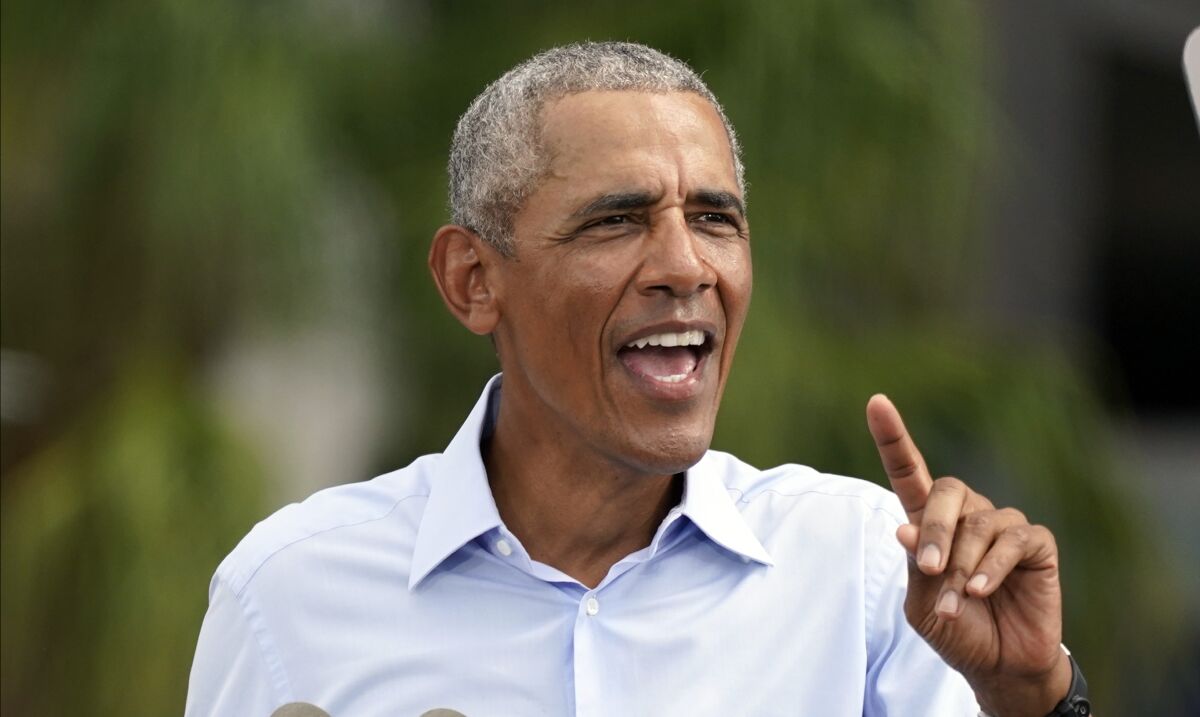 Former President Obama speaks in favor of Joe Biden, his former vice president, on Tuesday in Orlando, Fla.