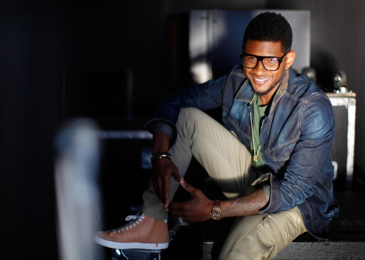 Usher poses for a photo in Burbank on June 2, 2012