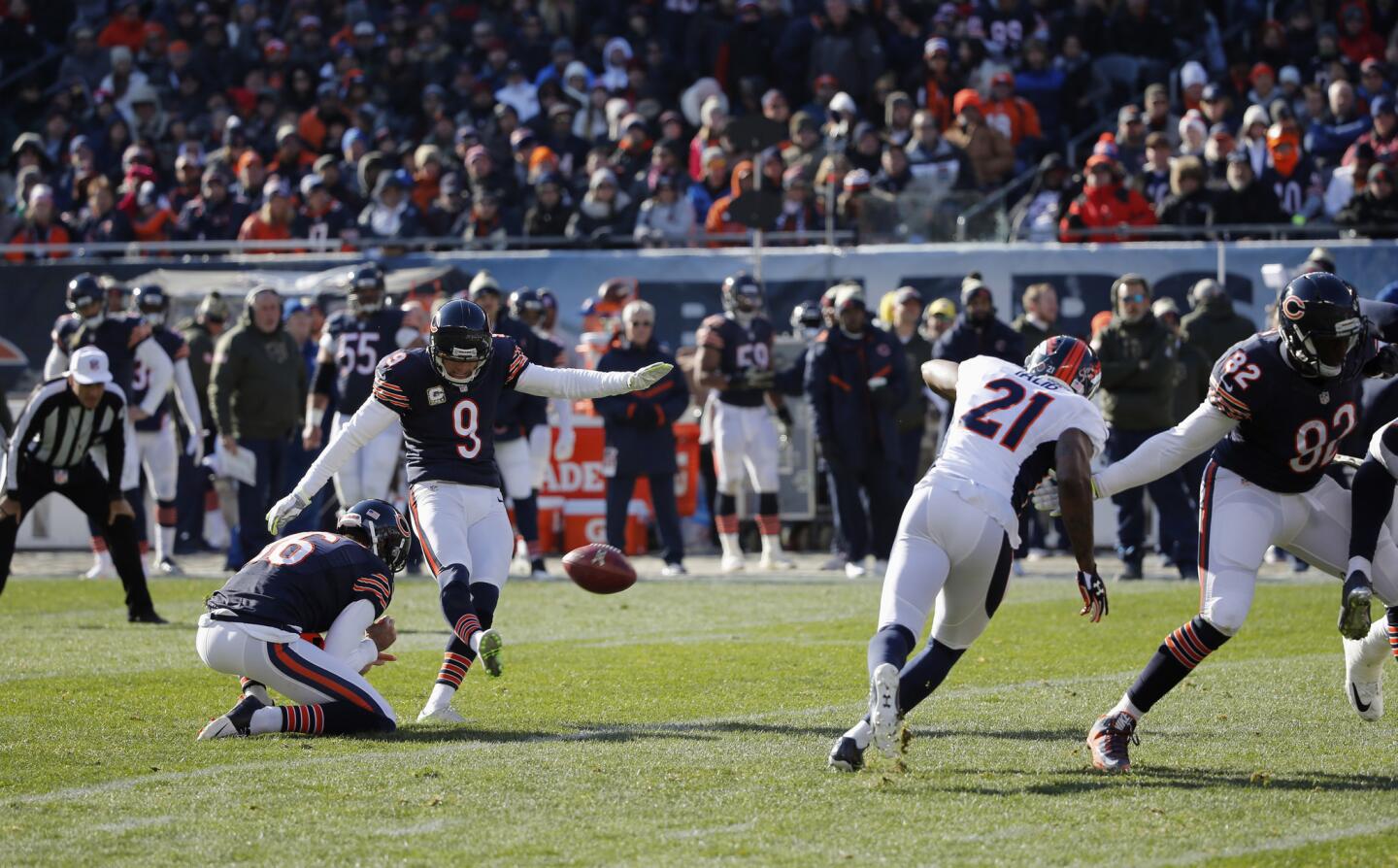 Robbie Gould kicks a field goal against the Broncos during the first half.