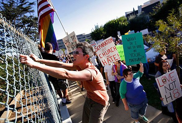 A protester screams at men standing outside the Mormon Temple in Westwood during a demonstration decrying the passage of Proposition 8, the ban on same-sex marriage. Leaders of the Church of Jesus Christ of Latter-day Saints had strongly urged members to contribute to the campaign for the measure.