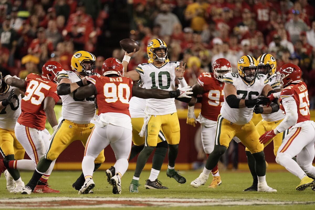 Green Bay Packers quarterback Jordan Love throws under pressure during Sunday's game in Kansas City. 