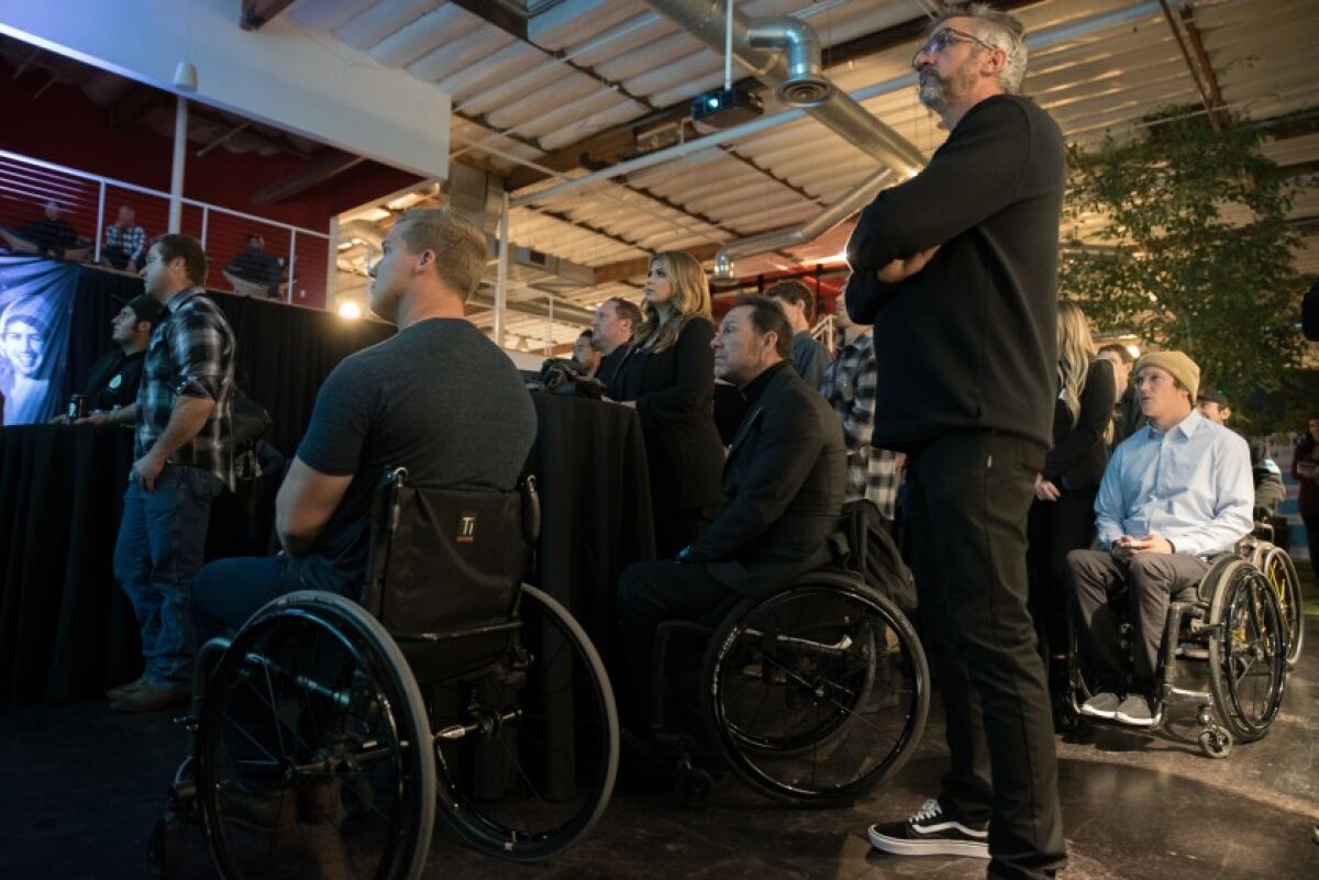 Athletes, employees and volunteers gather to watch the premiere episode of the “Road 2 Recovery” documentary web series at Fox HQ in Irvine on Dec. 12. The series profiles five injured motorcycle and BMX athletes supported by the Road 2 Recovery Foundation in Encinitas.