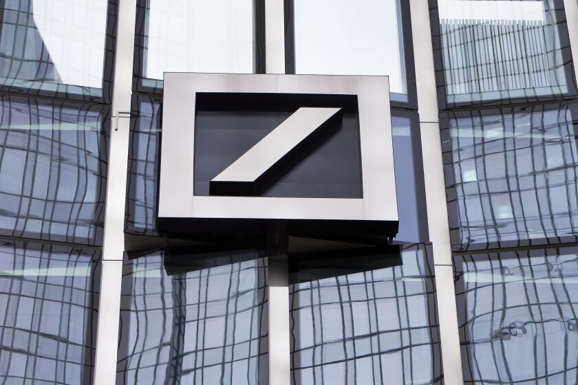 FILE - The Deutsche Bank logo is displayed at a bank's building in Frankfurt, Germany, April 9, 2018. Shares in Deutsche Bank, Germany’s largest lender, have fallen sharply and dragged down major European banks as fears about weaknesses in the global financial system send fresh shudders through the markets. Deutsche Bank shares were off more than 12% in midday trading in Frankfurt on Friday, March 24, 2023. (AP Photo/Michael Probst, File)