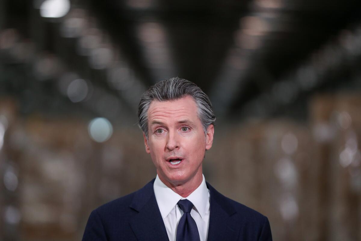 Governor Gavin Newsom speaks during a press conference to unveil the next phase of California's pandemic response. 