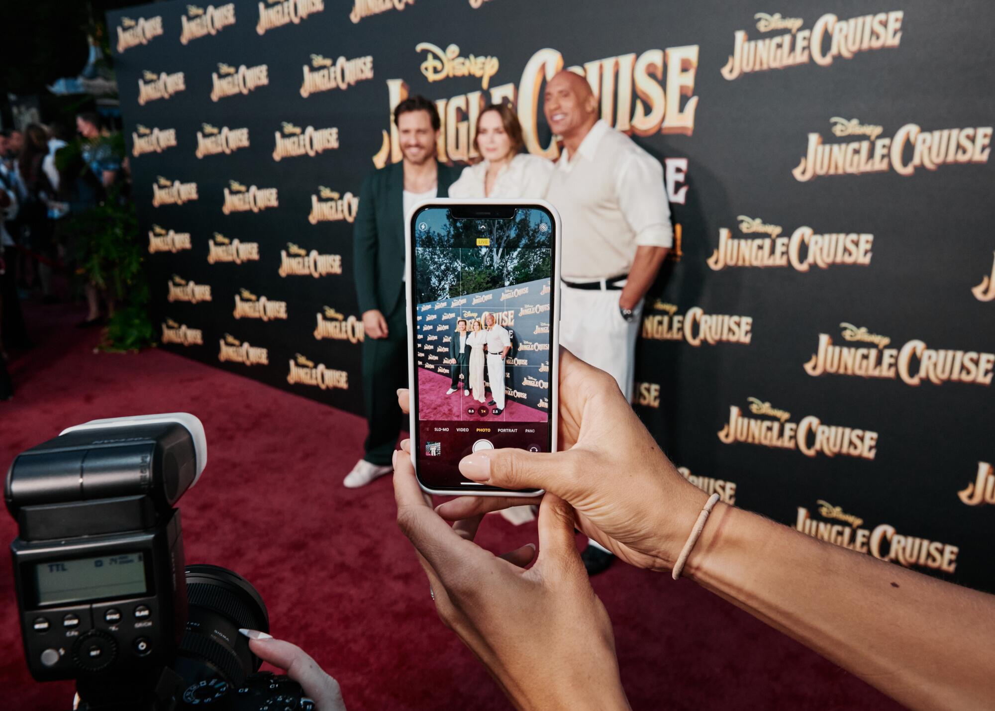 Edgar Ramirez, Emily Blunt and Dwayne Johnson pose for photographers.