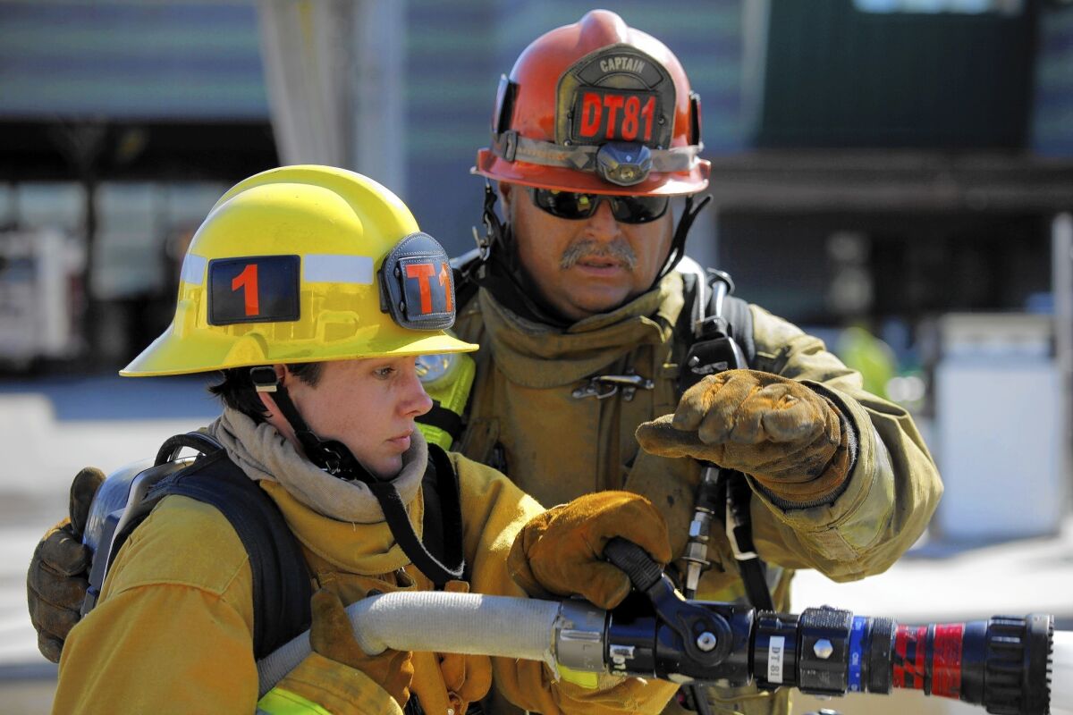 Erica Juergens in March, during training to be a firefighter. She resigned Monday, citing personal reasons.