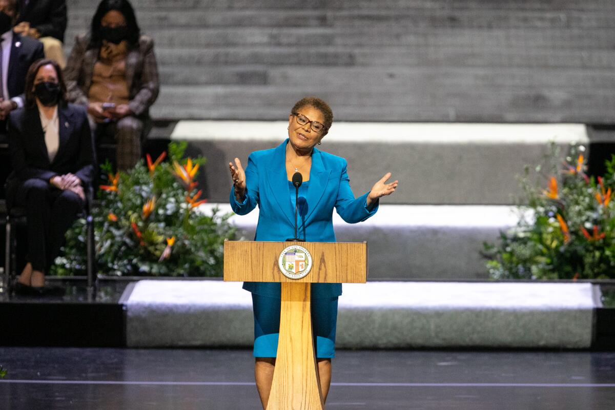 A person speaks at a lectern.