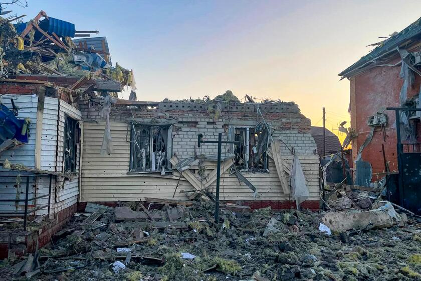 This photo released by the acting Governor of Kursk region Alexei Smirnov telegram channel , shows a damaged house after shelling by the Ukrainian side in the city of Sudzha, Kursk region that borders Ukraine, Tuesday, Aug. 6, 2024. Russian officials said Wednesday they were fighting off Ukrainian cross-border raids in a southwestern border province for a second day, as Kyiv officials remained quiet about the scope of the operation. (Governor of Kursk region telegram channel via AP)