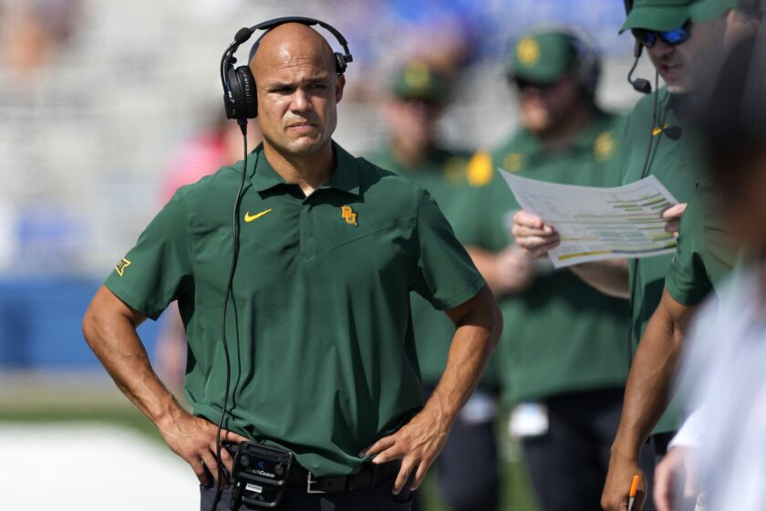 Baylor head coach Dave Aranda walks the sidelines during the first half of an NCAA college football game against Kansas in Lawrence, Kan., Saturday, Sept. 18 2021. (AP Photo/Orlin Wagner)