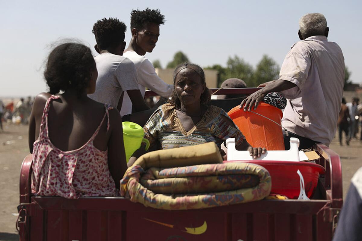 Refugees from the Tigray region of Ethiopia arrive in Hamdayet, Sudan, on Saturday.