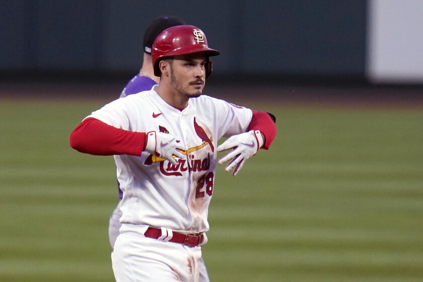 St. Louis Cardinals' Nolan Arenado celebrates after hitting a ground-rule double during the second inning of a baseball game against the Colorado Rockies Friday, May 7, 2021, in St. Louis. (AP Photo/Jeff Roberson)