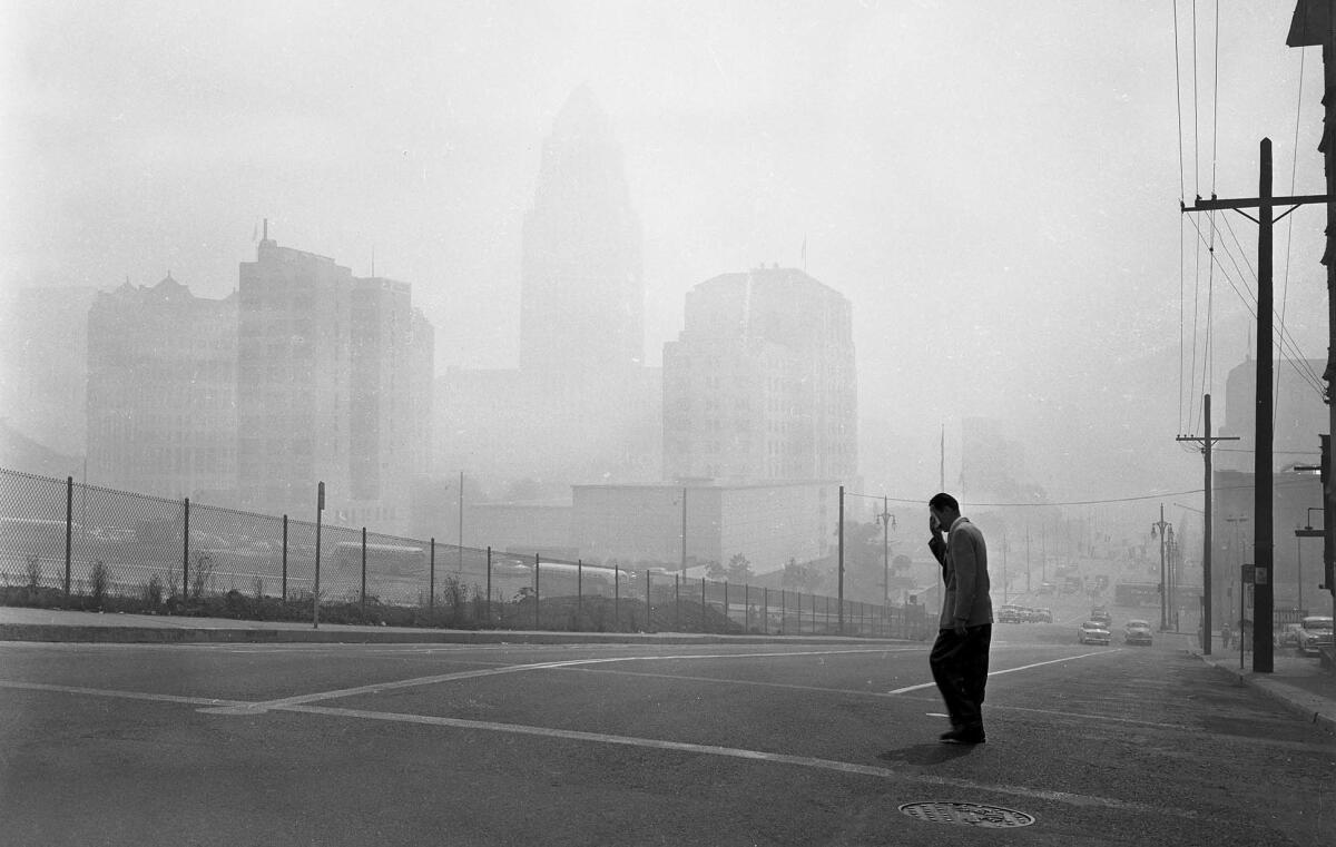 Sept. 13, 1955: Buildings in Los Angeles Civic Center are barely visible in a picture looking east at 1st and Olive streets.