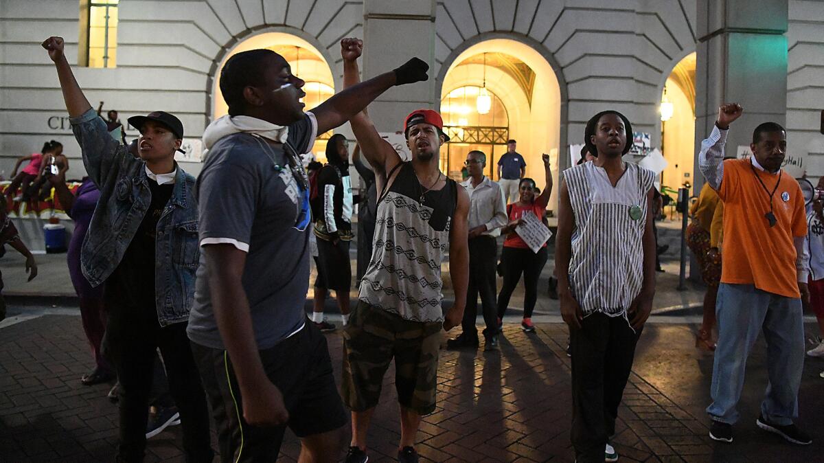 Protesters supporting the Black Lives Matter movement chant outside L.A. City Hall on Thursday as they occupy space near the entrance on South Main Street.