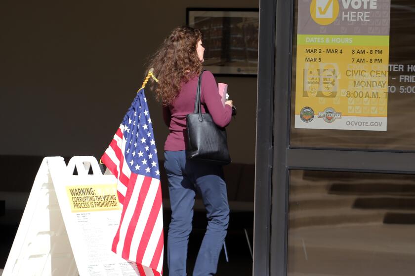 Voters walk into Huntington Beach Civic Center on Super Tuesday to vote in Huntington Beach on Tuesday, March 5, 2024. (Photo by James Carbone)