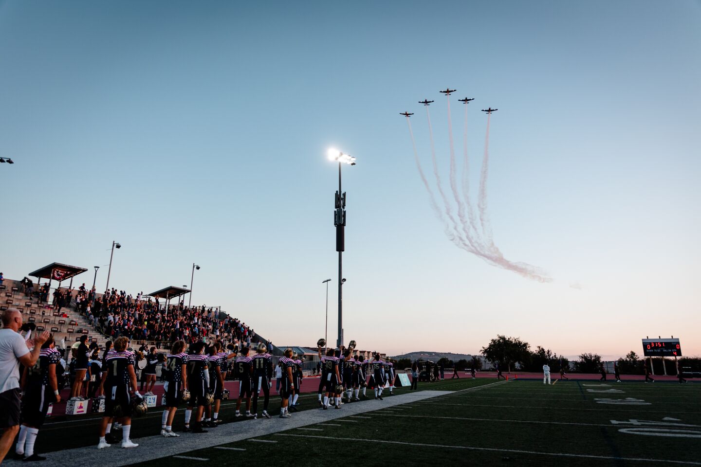The 5 Beechcraft T34 Mentor planes flew by the Del Norte High stadium at an altitude of 800 feet. They performed for 6 minutes.