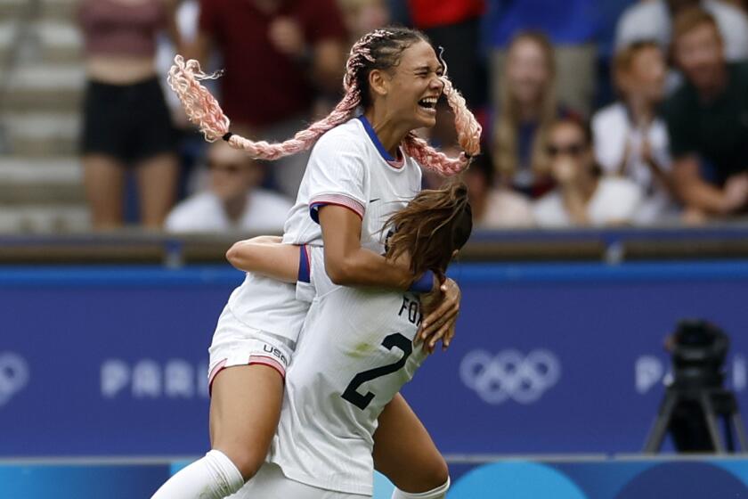 Trinity Rodman of the United States, top, celebrates after scoring the opening goal.