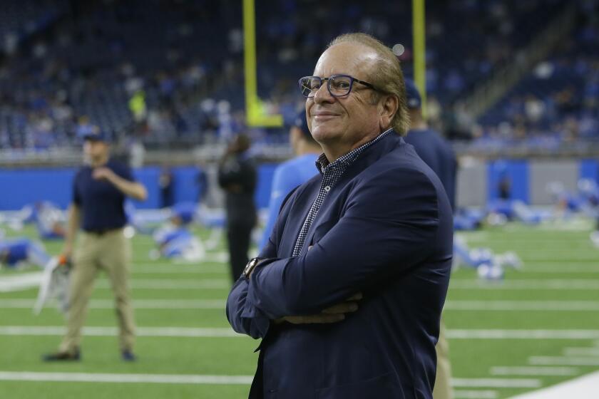 Los Angeles Chargers owner Dean Spanos watches his team warm up for an NFL football game.