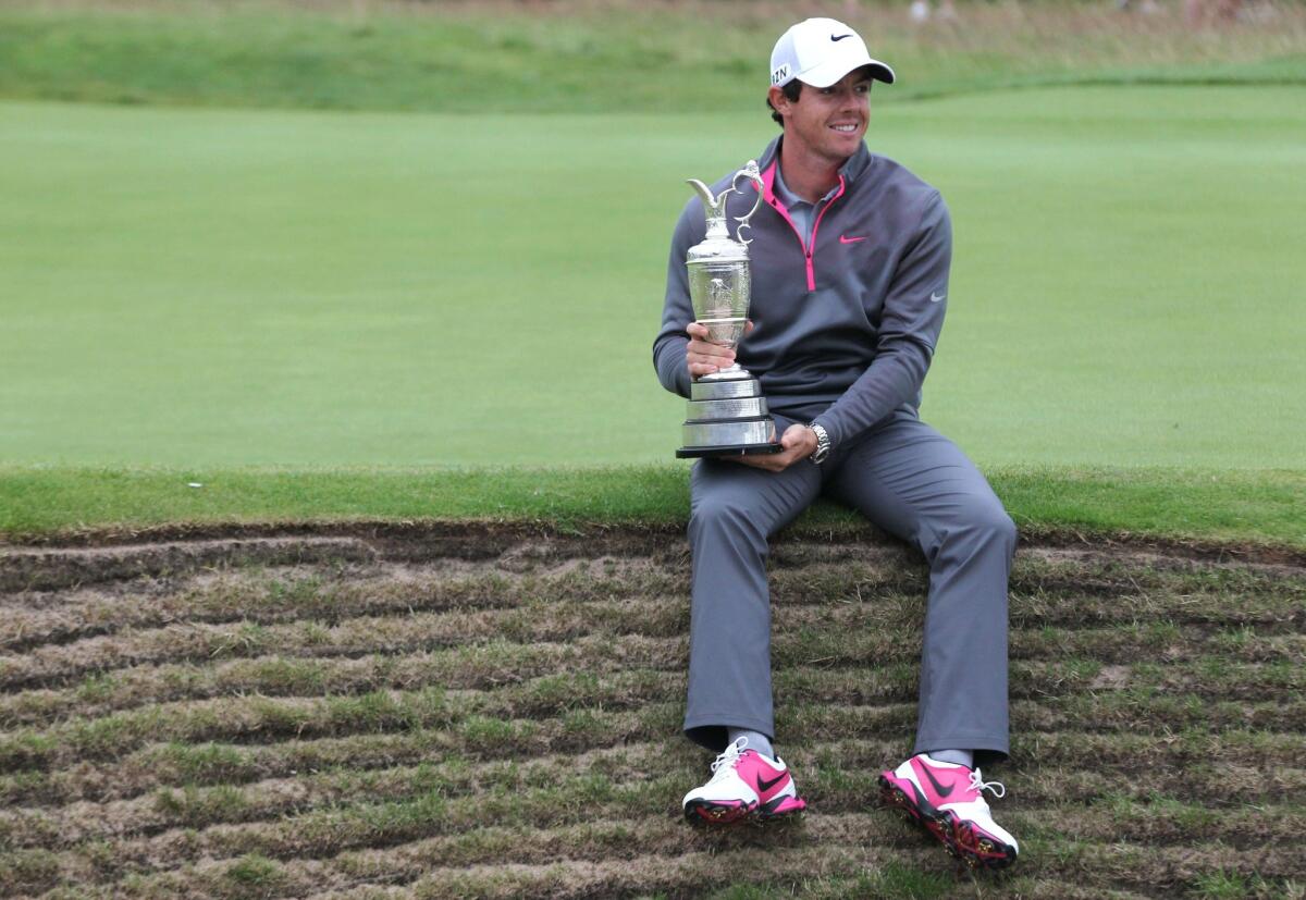 Northern Ireland's Rory McIlroy holds the Claret Jug after winning the 2014 British Open on July 20.