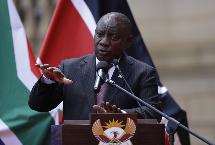 South African President Cyril Ramaphosa addresses the media after meeting with his Kenyan counterpart Uhuru Kenyatta in Pretoria, South Africa, Tuesday Nov. 23, 2021 . Kenyatta is in South Africa on a state visit to discuss political and economic issues. (AP Photo/Themba Hadebe)