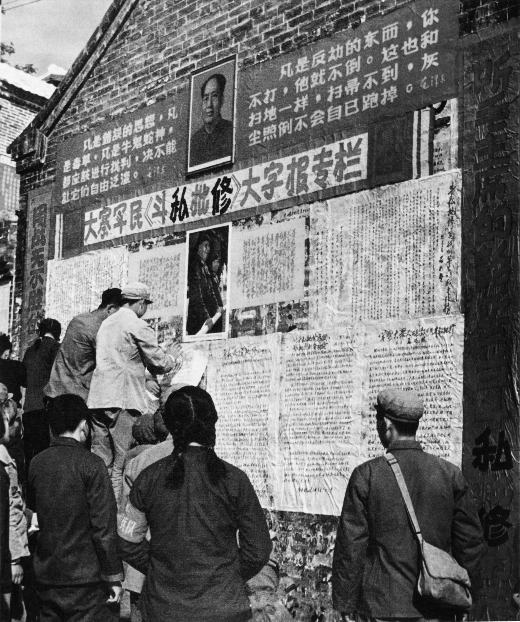 "Big character posters" are put up by peasants and soldiers, circa 1970.