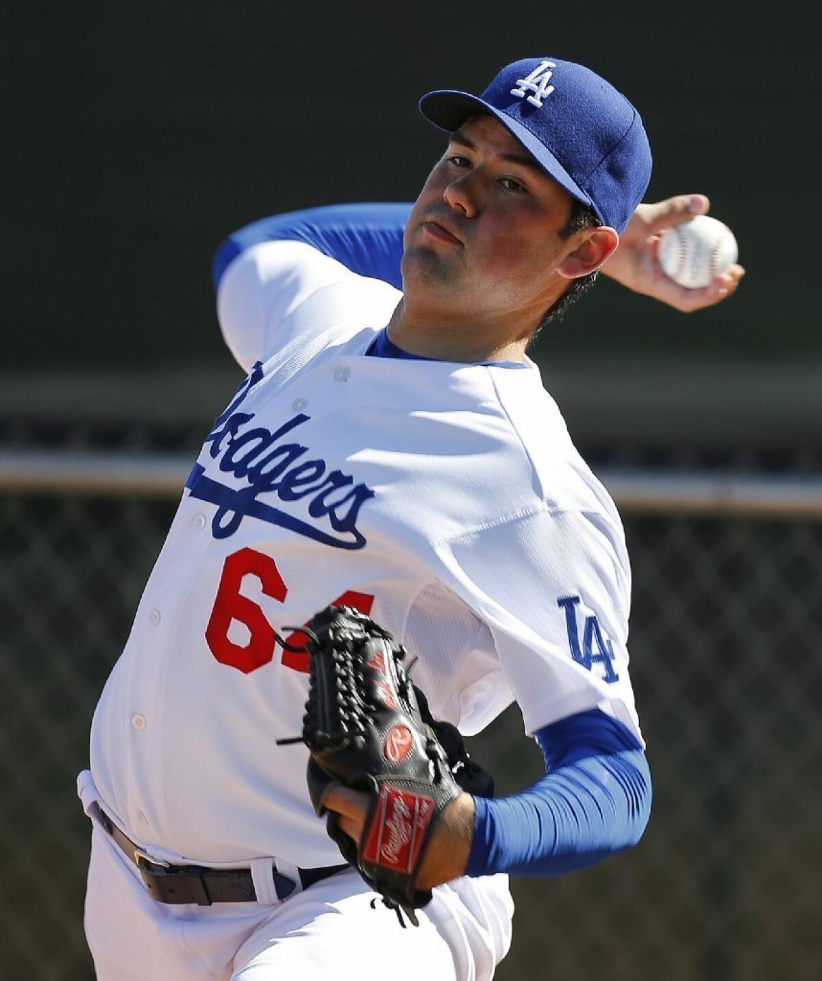 Dodgers pitcher Zach Lee throws during spring training on Feb. 20 in Glendale, Ariz.