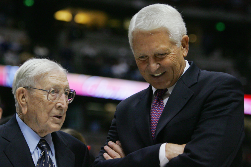 Former UCLA head coach John Wooden speaks coach Lute Olson of the Arizona Wildcats after the game.