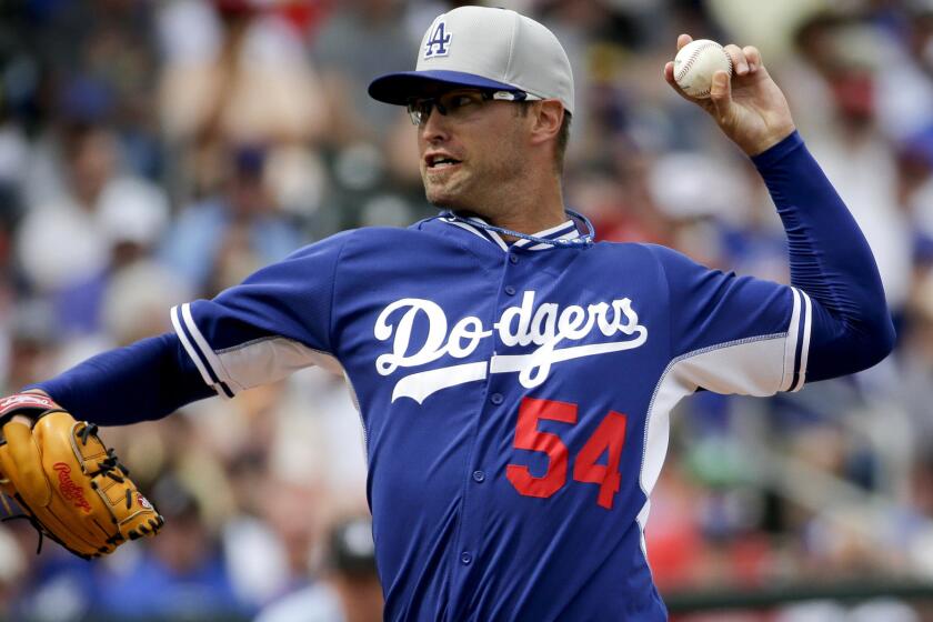 Dodgers reliever David Huff pitches against the Cubs during a spring training game on March 11.