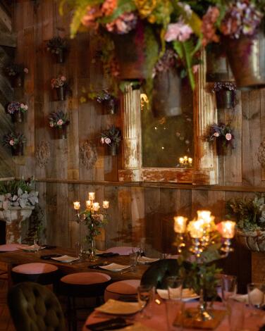 A restaurant with candles and floral decorations
