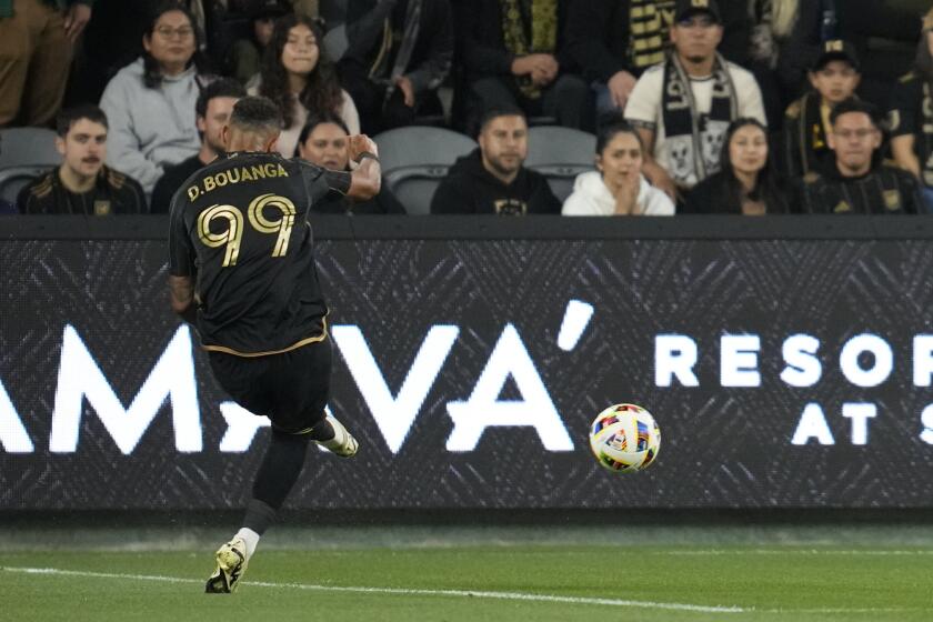 Los Angeles FC forward Denis Bouanga scores during the first half of an MLS soccer match against the Vancouver Whitecaps in Los Angeles, Saturday, May 11, 2024. (AP Photo/Ashley Landis)