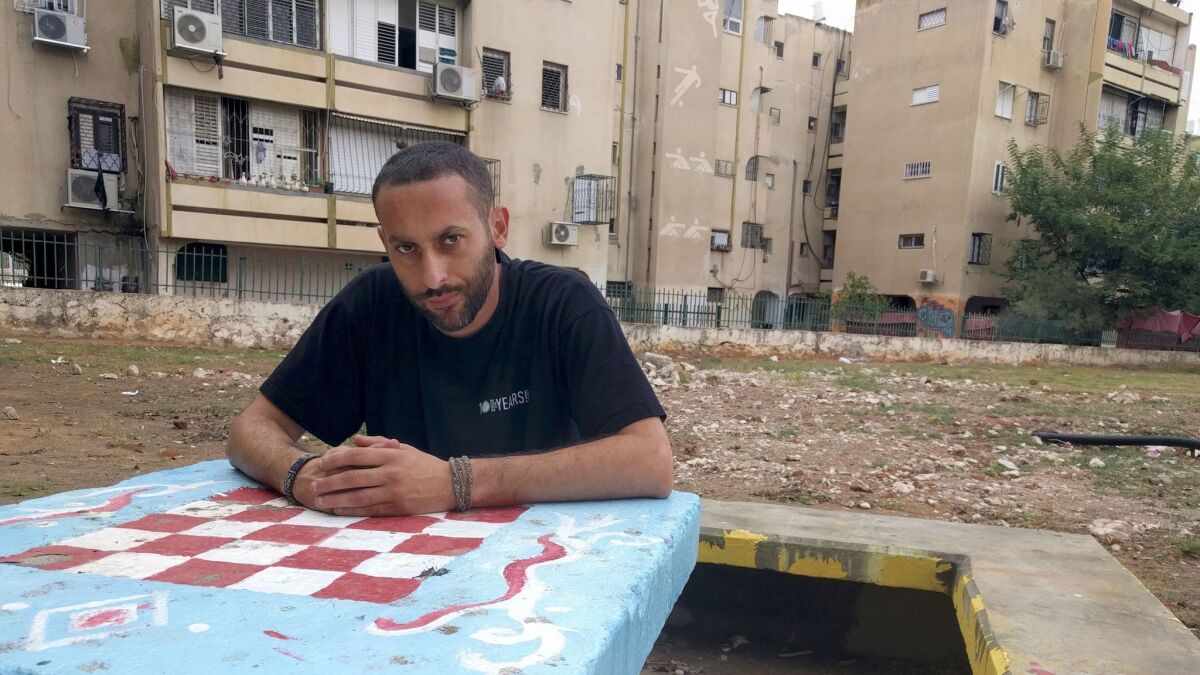 Palestinian-Israeli hip-hop artist Tamer Nafar visits his old neighborhood of Ramat Eshkol in the Israeli city of Lod, the inspiration of a semiautobiographical feature film "Junction 48," which opens in the U.S. in March.