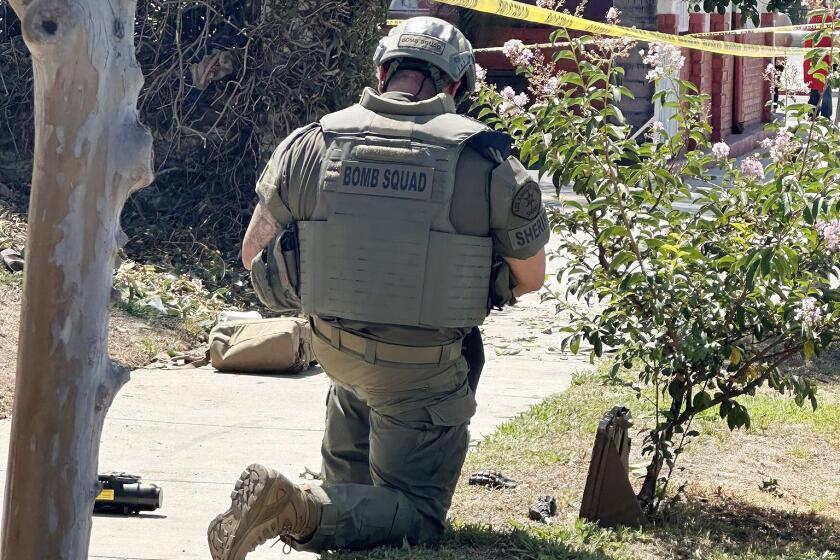 The Los Angeles County Sheriff's SEB Tactical Bomb Tech on scene, where four hand grenades in a Baldwin Park neighborhood on Aug. 22.The cache of grenades were found in the 13800 block of Los Angeles Street just after 10:30 a.m. by a gardener working in the area.