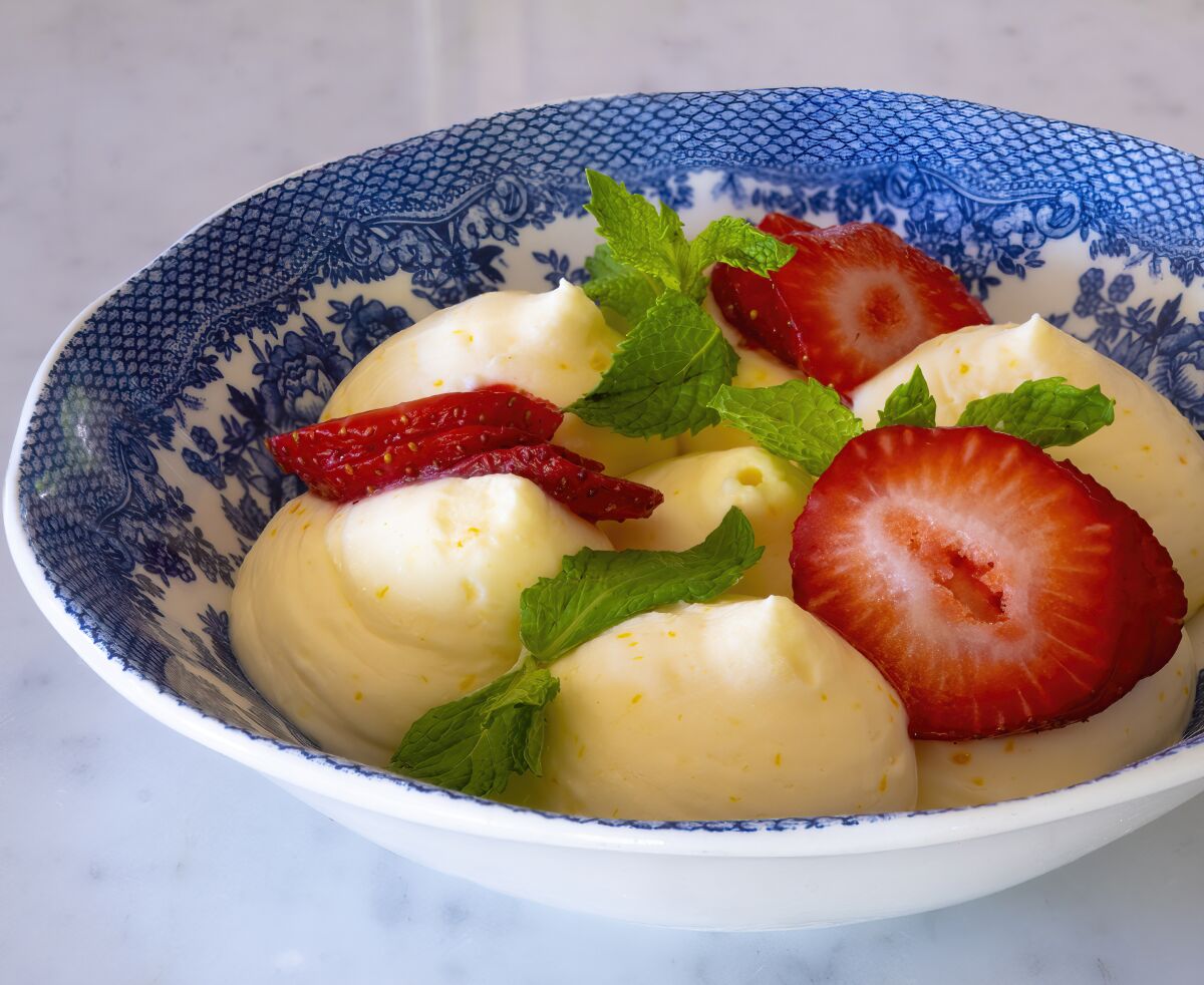 Lemon Mousse offers a blissfully lush, citrusy taste of summer, topped with sliced strawberries.