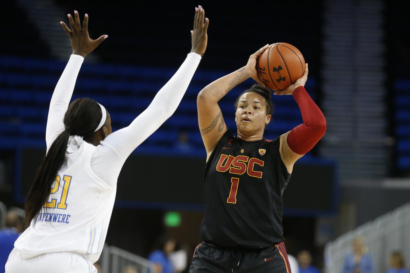 USC forward Kayla Overbeck looks to pass in front of UCLA forward Michaela Onyenwere during the Bruins' win.