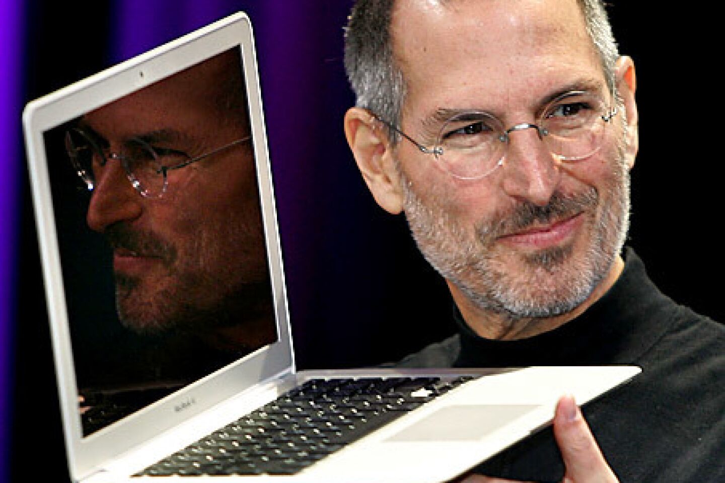 Jobs shows off the new Macbook Air, a small, light laptop, during his keynote speech at the 2008 MacWorld conference in San Francisco. Almost exactly one year later, Jobs announced that he would take a medical leave of absence from Apple through June, saying his health issues were "more complex than I originally thought."
