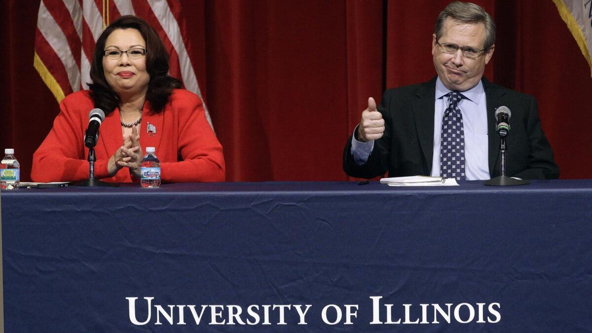 Republican Sen. Mark Steven Kirk and Democratic Rep. Tammy Duckworth face off in their first televised Senate debate in Springfield, Ill.