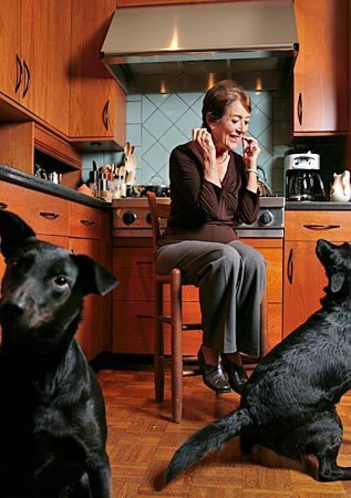 "I really loved doing those dinner parties," says Nina Lamb, with her canine helpers in her Santa Monica home. ". . . It was something that was part of our life."