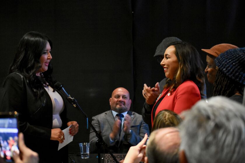 Paloma Aguirre, right, is sworn in as Imperial Beach mayor by San Diego County Supervisor Nora Vargas, left, on Wednesday, Dec. 14, 2022.