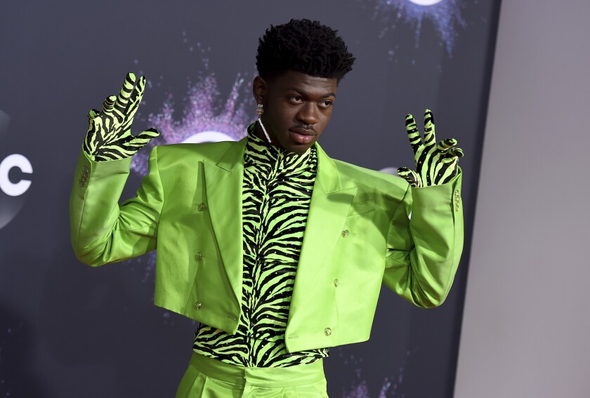 Lil Nas X turns green at the American Music Awards.