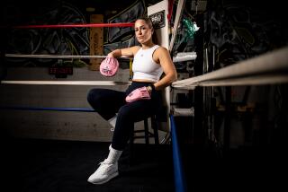 El Cajon, CA - March 22: Ann Najjar, aka "The Mitt Queen," poses for a photo at the Bomber Squad Boxing Academy on Wednesday, March 22, 2023 in El Cajon, CA. Najjar is a boxing trainer from San Diego, who works with professional and Olympic athletes, celebrities, and appears in the movie "Creed III" with Michael B. Jordan and Jonathan Majors. (Meg McLaughlin / The San Diego Union-Tribune)
