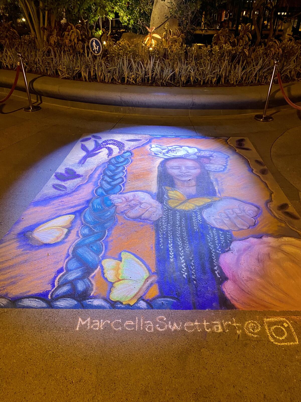 A chalk mural by artist Marcella Swett at Downtown Disney.