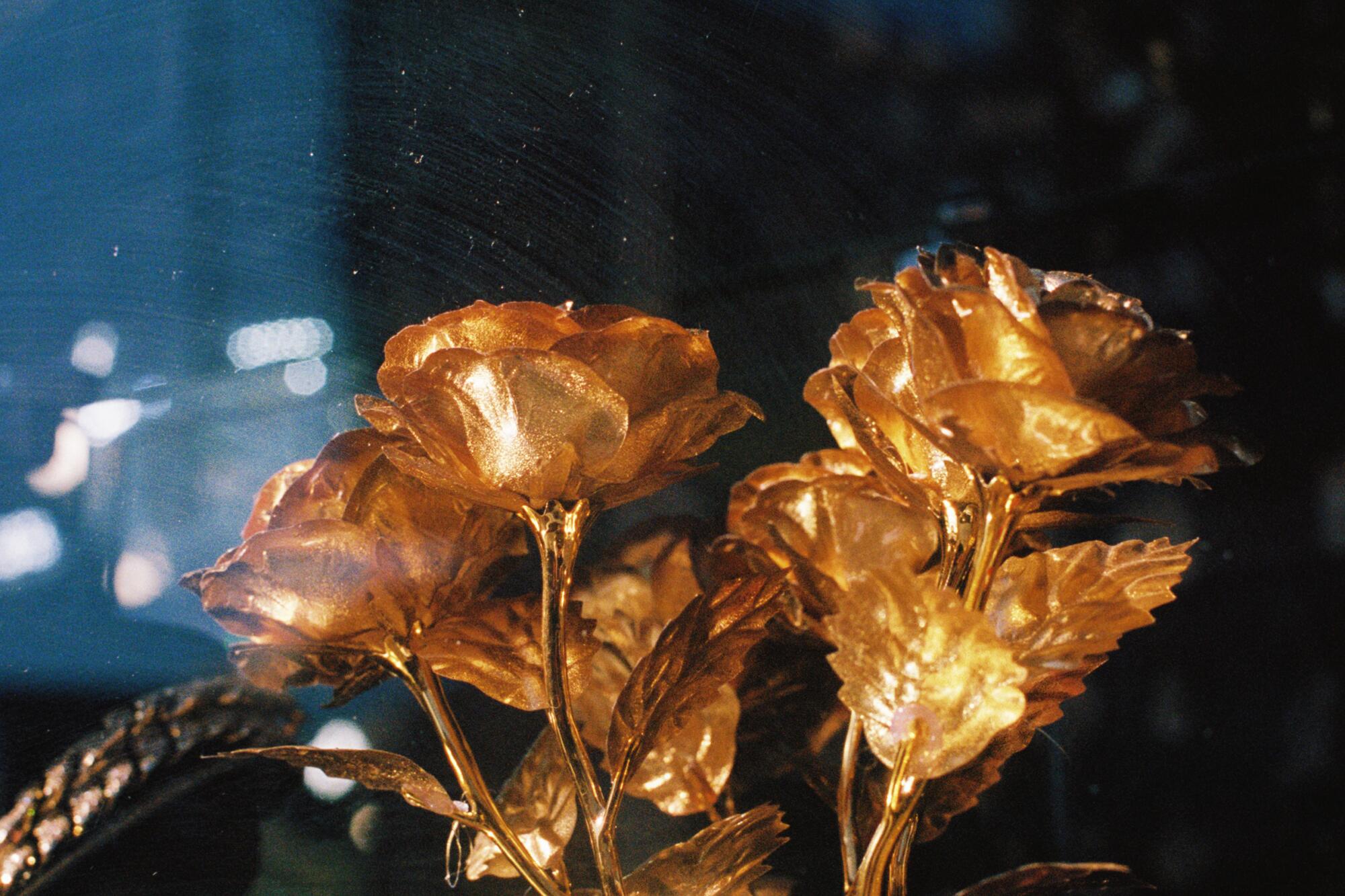 Clifford Prince King's photograph of gold-dipped flowers and a gold chain